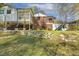Expansive backyard featuring a well-maintained lawn, multi-level patios, and home exterior at 105 Blanchard St, Fuquay Varina, NC 27526