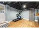 A basement workout area with fitness equipment and access to the backyard at 105 Blanchard St, Fuquay Varina, NC 27526