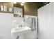 Charming bathroom featuring a pedestal sink, a tile floor, and a vintage mirror at 105 Blanchard St, Fuquay Varina, NC 27526