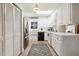 Efficient kitchen with white cabinetry, stainless steel fridge, and functional appliances at 105 Blanchard St, Fuquay Varina, NC 27526