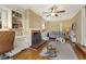 Cozy living room with built-in shelves, a decorative fireplace, and ample natural light at 105 Blanchard St, Fuquay Varina, NC 27526