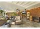 Comfortable covered patio with brick wall, entertainment center and ceiling fans at 105 Blanchard St, Fuquay Varina, NC 27526