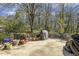 Back patio with many potted plants with multiple seating areas for outdoor relaxation and entertainment at 105 Blanchard St, Fuquay Varina, NC 27526