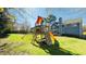 Backyard with a playset for children and a view of the home's exterior, perfect for Gathering fun at 105 Cherry Grove Dr, Cary, NC 27519