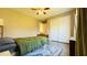 Cozy bedroom with tan walls, star decals, and a ceiling fan, with ample closet space at 105 Cherry Grove Dr, Cary, NC 27519