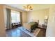 Cozy bedroom featuring wood floors, a rug, and a large window for ample natural light at 105 Cherry Grove Dr, Cary, NC 27519