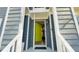 Open lime green front door leading into the gray home, view of house number and trim at 105 Cherry Grove Dr, Cary, NC 27519