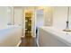 Upstairs hallway with views into a bedroom and bathroom at 105 Cherry Grove Dr, Cary, NC 27519