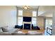 Bright living room featuring a fireplace, large windows, and neutral decor at 105 Cherry Grove Dr, Cary, NC 27519