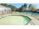 Community hot tub next to the large outdoor pool, surrounded by a black metal fence at 105 Cherry Grove Dr, Cary, NC 27519