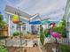 Backyard with a stone pathway, colorful umbrellas, and a pink flamingo at 10836 Connally Ln, Raleigh, NC 27614