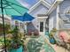 Inviting back patio with colorful umbrellas, comfortable seating, and a relaxing hammock at 10836 Connally Ln, Raleigh, NC 27614