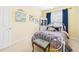 Charming bedroom features bright walls, colorful artwork, and a decorative white metal bed frame at 10836 Connally Ln, Raleigh, NC 27614