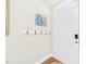 Bright entryway featuring hardwood floors and a coat rack at 10836 Connally Ln, Raleigh, NC 27614
