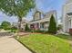 Inviting home with lush green lawn and well-maintained landscaping at 10836 Connally Ln, Raleigh, NC 27614