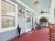 Cozy front porch with rocking chairs, decorative accents, and ample natural light at 10836 Connally Ln, Raleigh, NC 27614