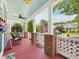 Inviting front porch with brick pillars, lattice fence, and comfortable seating at 10836 Connally Ln, Raleigh, NC 27614