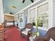 Inviting front porch with comfortable seating, ceiling fans, and cheerful decor at 10836 Connally Ln, Raleigh, NC 27614
