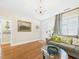 Cozy living room featuring hardwood floors, a comfortable sofa, and elegant chandelier at 10836 Connally Ln, Raleigh, NC 27614