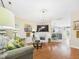 Bright living room with hardwood floors, fireplace, and comfortable seating at 10836 Connally Ln, Raleigh, NC 27614