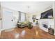 Comfortable living room with hardwood floors, fireplace, and stylish decor at 10836 Connally Ln, Raleigh, NC 27614