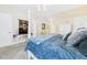 The primary bedroom includes a four-poster bed, wall-mounted television, sitting area, and en-suite at 10836 Connally Ln, Raleigh, NC 27614