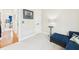 Sitting room featuring a comfortable blue sectional couch and neutral walls at 10836 Connally Ln, Raleigh, NC 27614