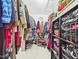 This walk-in closet includes shelves, racks, hanging clothes, and plenty of storage options at 10836 Connally Ln, Raleigh, NC 27614
