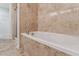 Bathroom features a soaking tub and tiled shower at 11003 Louson Pl, Raleigh, NC 27614