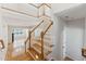 Bright foyer with hardwood floors, a staircase and an open floor plan at 11003 Louson Pl, Raleigh, NC 27614