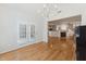 Hardwood floors enhance this large living space flowing into the kitchen area at 11003 Louson Pl, Raleigh, NC 27614