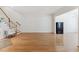 Spacious living room with hardwood floors and a staircase at 11003 Louson Pl, Raleigh, NC 27614