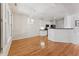 Hardwood floors enhance this large living space flowing into the kitchen area at 11003 Louson Pl, Raleigh, NC 27614