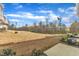 A spacious backyard with natural scenery offers room to relax and enjoy the outdoors with private patio at 1107 Pale Moss Dr, Durham, NC 27704