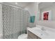 Bathroom featuring vanity, toilet, mirror, and patterned shower curtain at 1107 Pale Moss Dr, Durham, NC 27704