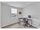Bedroom with window, desk, rolling desk chair, and carpeted floor at 1107 Pale Moss Dr, Durham, NC 27704