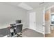 Bedroom featuring carpeted floor, gray walls, and neutral door at 1107 Pale Moss Dr, Durham, NC 27704