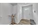 Bright entryway with hardwood floors, white trim, and a decorative vase with floral arrangement at 1107 Pale Moss Dr, Durham, NC 27704