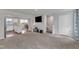 Open-concept living room next to a small dining area and kitchen at 1107 Pale Moss Dr, Durham, NC 27704