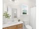 Clean bathroom features a vanity, large mirror, and natural light at 111 Silver Moon Ln # 121, Clayton, NC 27527