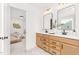Bathroom featuring a double sink vanity with modern fixtures and stylish marble floors at 111 Silver Moon Ln # 121, Clayton, NC 27527