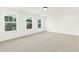 Bright bedroom with expansive windows providing abundant natural light and outdoor views at 111 Silver Moon Ln # 121, Clayton, NC 27527
