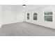 Spacious bedroom with large windows offering bright, natural light, perfect for relaxation at 111 Silver Moon Ln # 121, Clayton, NC 27527