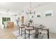 Bright dining room adjacent to an open kitchen, complete with modern lighting and stylish decor providing a welcoming space at 111 Silver Moon Ln # 121, Clayton, NC 27527