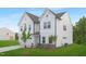 Lovely two-story white home with a spacious two-car garage and lush green lawn providing a picturesque setting at 111 Silver Moon Ln # 121, Clayton, NC 27527