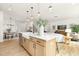 Modern kitchen with large island that opens to the dining and living areas, designed for seamless entertaining at 111 Silver Moon Ln # 121, Clayton, NC 27527