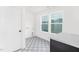 Convenient laundry room featuring stylish tiled floors, and abundant natural light from exterior windows at 111 Silver Moon Ln # 121, Clayton, NC 27527