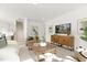 Comfortable living room with hardwood flooring and natural light at 111 Silver Moon Ln # 121, Clayton, NC 27527