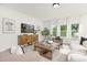 Well-lit living room with stylish decor and hardwood floors at 111 Silver Moon Ln # 121, Clayton, NC 27527