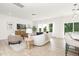 Bright living room features large windows, modern sofa, and stylish decor at 111 Silver Moon Ln # 121, Clayton, NC 27527